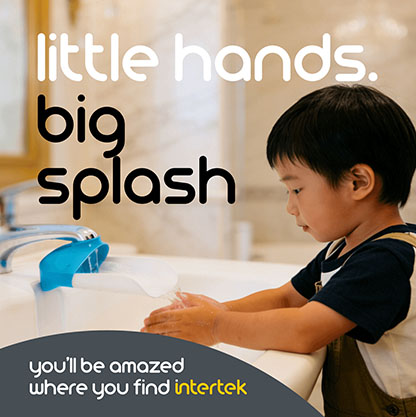 A young boy washing his hands at the sync